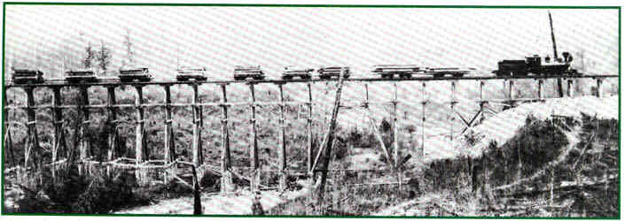 logging train crossing the pine river.JPG (59321 bytes)